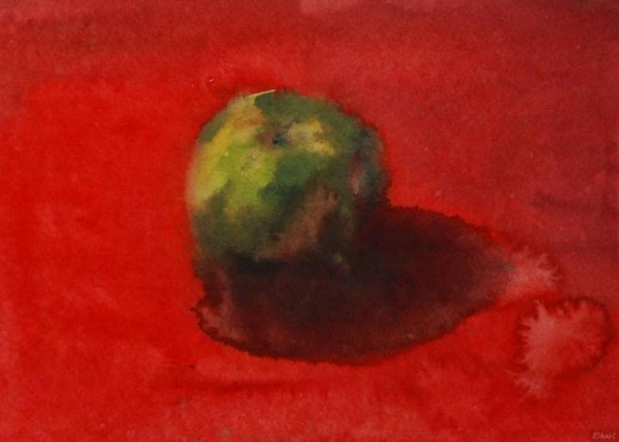 Яблоко на красном фоне